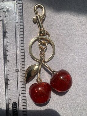 🆕- MINI SPARKLING CHEERY’S  BAG OR KEYRING CHARM GOLD HARDWARE